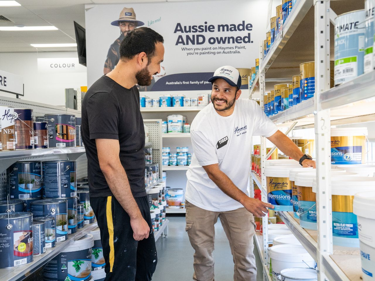 Haymes Paint expert assisting customer with DIY painting advice and product selection