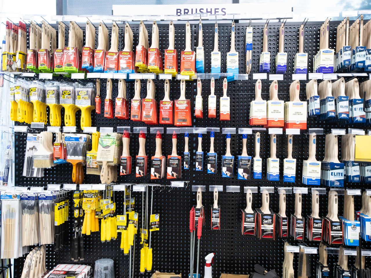 Display of premium paint brushes and DIY painting tools for home improvement projects