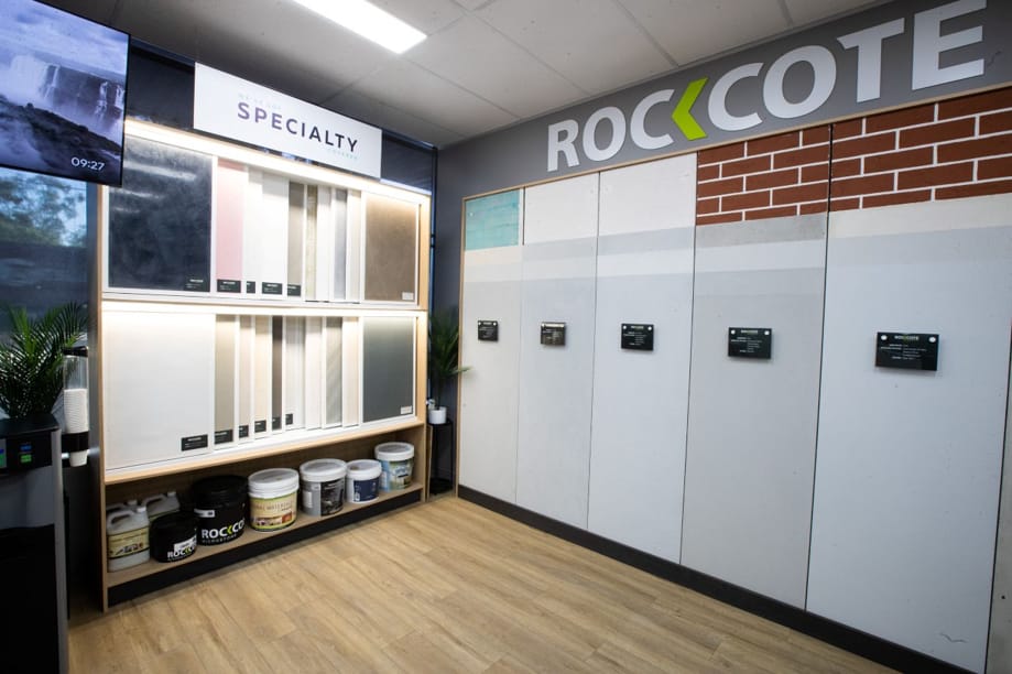 Specialty wall finishes on display at a Network Render & Paint showroom